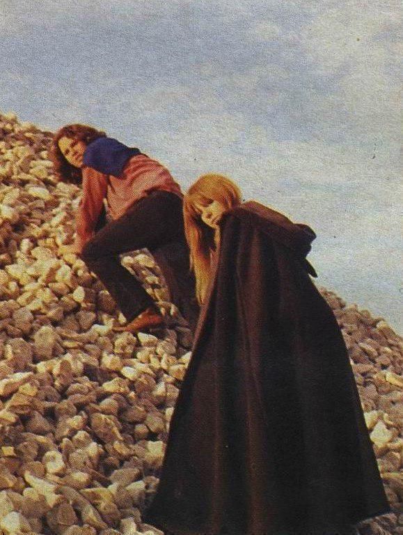 Jim and Pamela climbing what appears a rock hill June 28 1971 in St Leu dEsserent