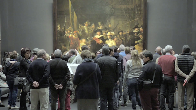 videoblocks amsterdam netherlands may 10 2017 people watching the picture the night watch or the militia company of captain frans banning cocq of rembrandt in the rijksmuseum h 3uvyngb thumbnail full01
