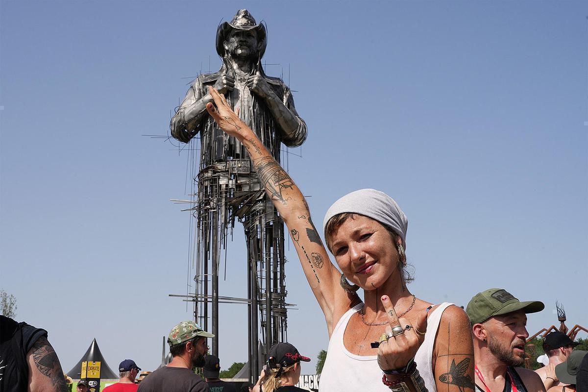 attachment Caroline Brissett With Lemmy Statue at 2022 Hellfest