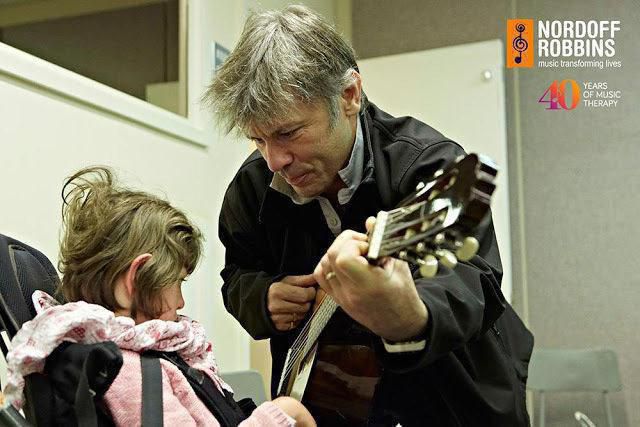 55887088 iron maiden frontman bruce dickinson visits londons music therapy center image